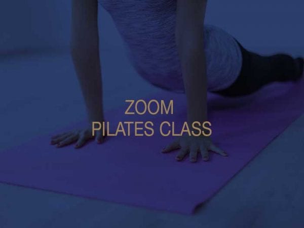 A woman taking part in a zoom pilates class